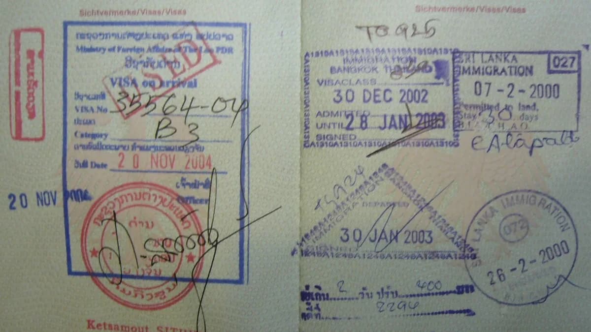 Stamped visa documents, issued by Laos, Thailand and Sri Lanka (from left to right)